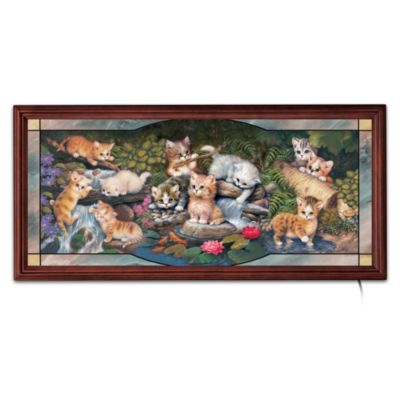 A rushing stream with lily pads and bright orange goldfish is a treasure-trove of adventure for the eleven curious kittens in this collectible kitten wall decor art! Join in the fun as internationally famed artist Jurgen Scholz's cat art comes to life - and to light - for the very first time in this large-scale, illuminated stained-glass limited edition. Just plug it in and light up your home with the adorable antics of kittens at play!A Bradford Exchange exclusive, this kitten wall decor art is hand-fired, with graceful lines that emulate age-old glaziers' lead, a handsome marbleized border, and a rich custom wood frame. It's sure to add a joyous glow to any room in your home, or it makes an ideal cat-lover home decor gift, but don't wait! Strong demand is expected, so order now!