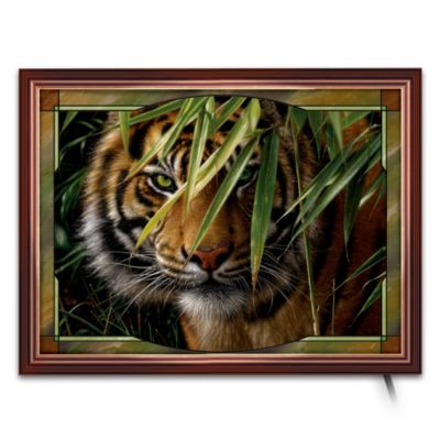 The regal tiger is a reminder of nature's untamed power and vanishing beauty. Now, you can enjoy this majestic animal with collectible stained-glass tiger wall art. This heart-pounding, breathtaking Collin Bogle wildlife art is recreated on hand-fired glass and impressively sized for a dramatic effect.The tiger's undisputed dominance is expressed in this gripping stained-glass wall art, available only from The Bradford Exchange. The wildlife art's intricate detail and rich colors become even more powerful when you flip the switch. Long-lasting lights built into the custom wood frame of this tiger wall art provide up to 10,000 hours of soft illumination. Enthusiastic demand is expected, and you won't want to miss out. Order now!