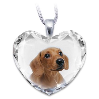 One look into the adoring eyes of our precious Dachshund companions and they've won their way into our homes and hearts. Show your love for your faithful friend with this heart-shaped Dachshund pendant necklace, a fine jewelry design exclusively from The Bradford Exchange.With an adorable full-color portrait of a Dachshund as the centerpiece, this handcrafted Dachshund pendant jewelry captures a Dachshund's sparkling personality within the multi-faceted brilliance of a heart-shaped crystal pendant. The pendant is coupled with the gleam of a solid sterling silver bail and a sleek 18" solid sterling silver chain and arrives in a custom-designed gift box. A delightful way to show your love for a devoted friend, this Dachshund pendant necklace makes a perfect keepsake to wear or a wonderful Dachshund lover jewelry gift. High demand is expected, so don't delay. Order now! California Residents click here for Proposition 65 notice.