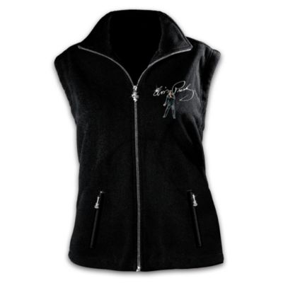 With the swivel of his hips and a curl of his lip, this songster changed the landscape of American music. A consummate performer we know and love - the one and only Elvis Presley&reg;. Now you can keep him close to your heart always with this exciting Elvis Presley fleece vest for women, a first-ever exclusive design from The Bradford Exchange. Slip into the distinctive rock 'n' roll style of this rich black fleece vest, embroidered on the front with a memorable image of Elvis&reg; from his '68 comeback special, along with his replica signature.On the back, the thrill continues with a beautiful design displaying iconic images of Elvis throughout his career. This significant Elvis memorabilia is expertly fashioned of soft mid-weight fleece, and features a flattering fitted cut that gets you ready to rock all year 'round. Glistening metallic zipper pulls of the famous TCB&reg; emblem and sculptural guitars further enhance this fashion first. So swivel your hips and curl your lip because you are destined for greatness too in this Elvis Presley fleece vest tribute. Also makes a stunning Elvis Presley fan gift! Strong demand is expected. Order now!