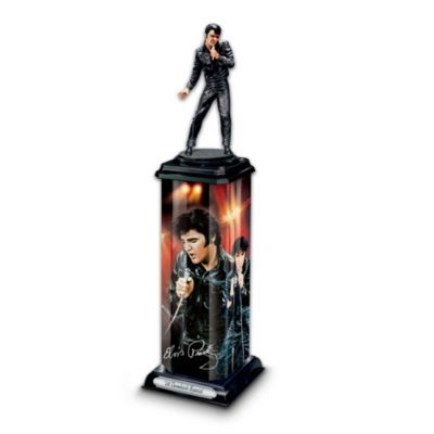 No other could ever equal the power, passion and electrifying stage presence of the King of Rock 'n' Roll&reg; - something Elvis proved all over again in his 1968 live television special. Now you can celebrate this groundbreaking moment with this stunning Elvis Presley&reg; commemorative sculpture, exclusively from The Bradford Exchange.This handcrafted, hand-painted sculpture of Elvis portrays the King of Rock 'n' Roll in his famous black leather outfit from his 68 Comeback Special. The sculpture sits atop a montage art from renowned artist Bruce Emmett showcased on a tower of lustrous acrylic and further embellished with a silvery Elvis signature replica and a title plaque on the base. Plus, this striking memorabilia illuminates from within at the flip of a switch. Strong demand is expected for this unique Elvis collectible. Edition strictly limited to 2,008, so order now!