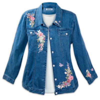 Now you can brighten any day and perk up any outfit by wrapping yourself in the beauty of roses. And it's not just any roses, but the glorious floral vision of internationally acclaimed artist Lena Liu. Introducing the Wrapped in Roses floral embroidered jacket, a fine apparel exclusive from The Bradford Exchange. Perfectly blending the casual style of everyday wear with the elegant presentation of fine art, this exquisite floral denim jacket is a fashion masterpiece. Expertly tailored of durable, stone-washed, medium weight denim in a figure-flattering cut, this floral embroidered jacket for women is styled with two front pockets, two side pockets and metal buttons. But best of all, every rose bud, blossom and butterfly from Lena Liu's fine artistry is captured in intricate embroidery, along the front of the jacket, on one of the sleeves, and even on the collar. Are you ready to be wrapped in roses? Don't miss out on this exclusive floral denim jacket. Order now!