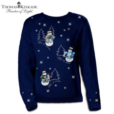 Make a festive fashion statement with the inviting Victorian artistry of the renowned Painter of Light! The wonders of winter come alive in this elegant Thomas Kinkade snowman sweater available only from The Bradford Exchange. Celebrate the season in style when you slip into this custom-designed embroidered sweater, expertly fashioned in a fine-gauge cotton-blend knit, chosen for its superior softness and drape. This fine Thomas Kinkade Christmas apparel is attractively crafted in rich midnight blue and adorned with colorful snowman appliques, white embroidered snowflakes and sparkling hand-applied simulated jewels. The cheerful words of "Let it snow" and outlined pine trees provide additional embroidered charm to this exquisite women's sweater. Its flattering natural cut falls to mid hip length, making it a joy to wear everywhere. Recall the warm memories of winter and this will soon be your favorite sweater of all time. Strong demand is expected for this artistic apparel exclusive, so don't wait. Order now!