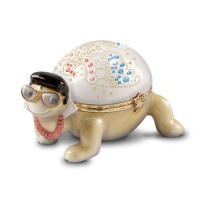 Everyone likes Elvis&reg; - even turtles! And there's no coaxing needed to bring this rocker out of his shell. He's a born entertainer just like his idol. Now you can celebrate the King of Rock 'n' Roll turtle style with this whimsical Elvis Presley music box, exclusively from The Bradford Exchange. Exquisitely handcrafted in Heirloom Porcelain&reg; and meticulously hand-painted, this collectible treasure features a turtle dressed like Elvis. From his shiny black hair, and 70s-style Elvis eyewear to his white shell with simulated jewels in the pattern of Elvis' American Eagle jumpsuit, this Elvis music box pays tribute to the famous Aloha from Hawaii concert. Plus, this Heirloom Porcelain turtle's shell opens on a Limoges-style hinge and closes with a golden TCB clasp. High demand is expected for this limited-edition Elvis collectible. Order now!