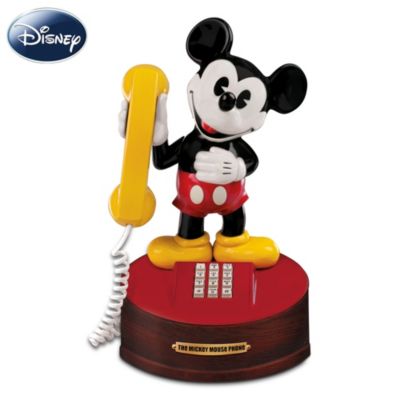 There is a character so popular, so lovable, so iconic, that in 1974 he was commemorated with his very own telephone. Ring, ring...who's there? It's everyone's beloved friend, Disney's Mickey Mouse. He's back to greet you with a limited-edition phone musical figurine - a scaled reproduction styled just like the original Mickey Mouse Phone. This historical collectibles opportunity is offered in an edition that is strictly limited to only 5,000 worldwide, and available from The Bradford Exchange.Standing over a foot tall, this impressive Mickey Mouse collectible is handcrafted and hand-painted in the finest Heirloom Porcelain&reg;, to ensure the lasting quality of this commemorative treasure. Lift Mickey's bright yellow receiver to your ear to hear the delightful sounds of "The Mickey Mouse Club March," and remember the magic all over again. Completed with a mahogany-finished base and a brass plaque, this unique Disney Mickey Mouse phone musical figurine even arrives in retro-style packaging for a truly authentic feel. Intense demand is anticipated for such a sought-after collectible. Don't miss Mickey's call - order now!A fine collectible, not intended for children.