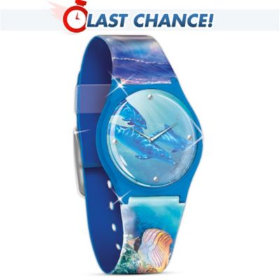 The breathtaking beauty of the sea is undeniable! Celebrate the timeless splendor of sea life with this first-ever ladies dolphin art watch featuring the work of celebrated marine artist Christian Riese Lassen. This casual-styled watch features stunning images from Mr. Lassen's acclaimed painting, "Mystical Journey." The watch face is adorned with swimming dolphins, while the band highlights seascapes with colorful fish and cascading waves. This stylish fashion statement is constructed with a precision quartz movement and is a fine jewelry design available only from The Bradford Exchange. The back of the watch face is engraved with the artist's signature, logo and the sentiment: Treasures of the Sea. Arrives in a custom-designed presentation case. Share your love of the sea by wearing this striking watch. Order now!
