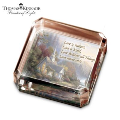 There's no artist who's captured breathtaking images time and again quite like the Painter of Light. Now, you can celebrate one of his personal career favorites and his Silver Anniversary as a published artist with this stunning Thomas Kinkade square paperweight, exclusively from The Bradford Exchange.Exquisitely handcrafted in sparkling crystal, this luminous paperweight features an embedded image of "The Forest Chapel," chosen by Thomas Kinkade himself especially for this luminous collectible. Plus, a touching verse from "First Corinthians" graces the front of this one-of-a-kind keepsake for a powerful statement of faith. A limited edition that makes the perfect inspirational gift and a beautiful reminder to add to your collection. High demand is expected and you won't want to miss out. Order now! California Residents click here for Proposition 65 notice.