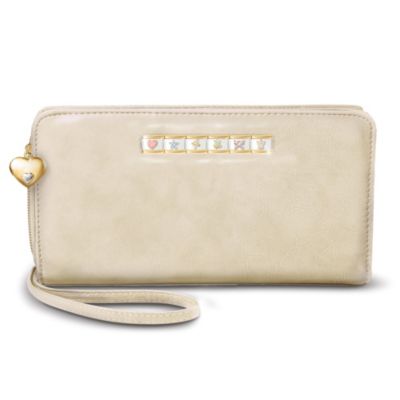 Let a special daughter carry your heartfelt wishes with her every day with a delightful leather clutch wallet accented with colorful, sparkling Italian charms that signify love, joy, hope, beauty, peace and more. Send charming wishes to a precious daughter with this lovely leather clutch wallet, only from The Bradford Exchange. Italian charm wallet is custom-crafted of luxurious leather. A dangling golden heart charm features a silvery heart on one side, and a touching inscription on the reverse. Inside is a framed panel bearing a loving message for your daughter. Wallet includes credit card pockets, bill compartment, key ring and detachable wrist strap. But hurry! Enthusiastic demand is expected, and you won't want to miss out. Order now!