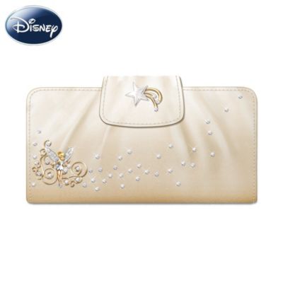 From the tips of her green slippers to the top of her golden blonde hair, Tinker Bell will always be in fashion. Now you can carry her style sense with you wherever you go with this "Believe in Magic" clutch wallet, available from The Bradford Exchange.This exquisite Disney licensed wallet is handcrafted in simulated leather and showcases a sparkling Tinker Bell charm surrounded by gold-toned vines.  A bas-relief metal shooting star charm glimmers on the wallet's snap closure while simulated jewels add a glamorous look. Plus, this adorable women's wallet includes ample pockets for cash and credit cards and a clear pocket window for easy access to your identification. There's also a pocket to hold a checkbook and a loop to hold a pen. Strong demand is expected and you won't want to miss out. Order now!A fine women's accessory, not intended for children.