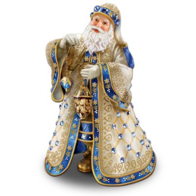 The holidays are a time of festive celebration with sparkling, colorful and opulent decorations. Add a touch of elegant opulence to your holiday decor with this first-ever collectible Santa figurine inspired by the artistry of Peter Carl Faberge. Sculptural Santa dons an exquisite flowing robe embellished with pearlescent finishes, golden accents and hand-applied Swarovski?? crystals, sparking simulated gems and pearls. He carries an ornate sculptural lantern. This limited-edition Peter Carl Faberge-style Santa figurine is only available from The Bradford Exchange. It's meticulously handcrafted by skilled artisans to recall the legendary "lost" Royal Danish Egg, then hand-painted in sapphire, white and golden tones. Strong demand is expected, so order now! California Residents click here for Proposition 65 notice.