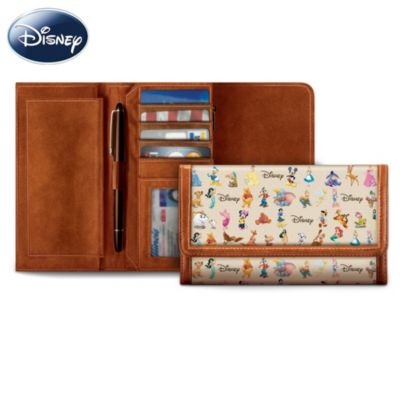 Now you won't ever have to leave your favorite Disney friends behind. You can always take them with you when you carry this magnificent Disney wallet featuring Mickey Mouse, Nemo, Princess Jasmine, Pinocchio, Winnie the Pooh, and so many more from the classic Disney films! This women's wallet is trimmed in leather, features full-color Disney character art all over, and is available from The Bradford Exchange.Custom crafted with fine hand stitching for added style and durability, this fashionable Disney accessory opens to reveal a zipper pocket for holding cash, 4 credit card pockets, a clear plastic pocket for your identification, and a removable leather checkbook cover. What a magical way to express you love for the Wonderful World of Disney. Don't miss a chance to carry your own Disney wallet - order now!This fine accessory is not intended for children.