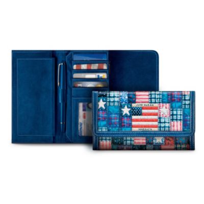 Make a declaration of your patriotic pride every time you use this women's flag wallet featuring the Americana art of acclaimed artist Mary Ann Lasher. The front flap has a red, white and blue patchwork-quilt design with stars and stripes, an American flag and the words, "God Bless America" in the center. This striking custom-crafted leather wallet features hand stitching for added style and durability. A compartment on the back zips closed with a heart-shaped flag charm for a patriotic finishing touch.This leather flag wallet is exclusively from The Bradford Exchange. The quality continues inside with a zipper pocket for holding cash, 4 credit card pockets, a clear plastic pocket for your identification, a removable leather checkbook cover and more. Strong demand is expected for this patriotic wallet, so order now!