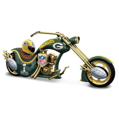 Celebrate the Green Bay Packers Super Bowl XLV victory in the best way - on two wheels! Available from The Bradford Exchange, this Green Bay Packers chopper figurine celebrates your favorite team with a tricked-out twist - sure to make heads turn and engines rev.Officially licensed by the NFL, this handcrafted Green Bay Packers Super Bowl XLV figurine features a sleek, custom-designed frame, real chrome-plated parts and bold paint scheme.  Green Bay Packers logos, colors and Super Bowl XLV motifs celebrating these 4-time Super Bowl champs makes this a must-have collectible for any Packers fan. Edition is limited to 5,000 and strong demand is expected, so don't delay. Order now!