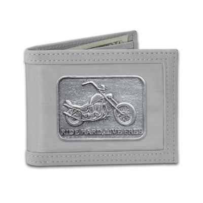 There's no feeling as thrilling as riding across the highway on a powerful motorcycle at full speed. Now, you can carry your passion for the road with you wherever you go with the first-ever stainless steel biker wallet, a singular achievement in craftsmanship and design, exclusively from The Bradford Exchange.Handcrafted with 25,000 flexible, stainless steel threads - three times thinner than a piece of paper - this motorcycle wallet has the strength that surpasses leather with a feel as slick as steel. Convenient interior compartments include three credit card slots, two pockets, an ID window and large pocket for bills. Plus, this stunning keepsake showcases an embossed custom chopper and the inspiring words, "Ride Hard, Live Free" and is finished with a matching faux suede trim and lining. Strong demand is expected for this market first treasure, so don't miss out. Order now!
