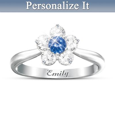 When your granddaughter was born, a seed of love was planted in your heart that will flower and bloom forever! To express the joy she brings you each day, this Precious Granddaughter Blossom Ring is the perfect gift, a personalized ring for granddaughter available only from The Bradford Exchange. Imagine how her eyes will light up when she discovers that your gift is personalized in two ways, with her genuine birthstone at the center of the "blossom" design, and with her name engraved inside the ring! Whether her birthstone is a glowing garnet (January), lustrous pearl (June), brilliant turquoise (December) or anything in-between, your granddaughter is sure to be delighted!This birthstone blossom ring is a fine jewelry exclusive handcrafted of shimmering, solid sterling silver. Five "flower petals" of sparkling, genuine white topaz surround the center birthstone - a genuine gemstone - to create the blossom design. You customize your granddaughter's ring when you choose her birthstone and provide her name to be engraved inside. Your personalized gift arrives in its own gift box with a gift card tucked inside that reads: "My Precious Granddaughter, You are a Beautiful Blossom in the Garden of Life." What a beautiful reminder of your love! To surprise your wonderful granddaughter, don't delay. Order now!