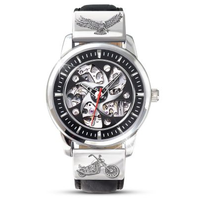 Motorcycle enthusiasts love the freedom of the open road and keeping it real. This motorcycle skeleton watch honors that tradition. The watch face features custom blade-spoke rim styling for a rugged and dramatic see-through design. The 21 jewel, automatic self-winding Miyota 8N24 movement provides precision timekeeping. And the hardened mineral crystals provide an enhanced view, front and back, of the mechanical movement.This sleek motorcycle watch is a custom-crafted design exclusively from The Bradford Exchange. It's expertly crafted in surgical grade stainless steel that provides durability, and is water resistant up to 3 ATM. The stitched black leather band is fully adjustable and features brushed silver-tone metal end caps with embossed eagle and chopper design. Arrives in a custom-designed case, ready for gift giving. Strong demand is expected, so order now!