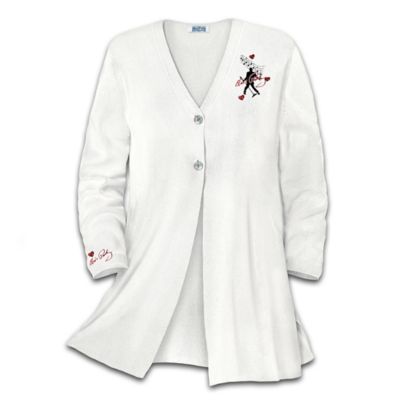 The voice, the jet-black hair, his mesmerizing charm. On stage and off, Elvis Presley&reg; had a style all his own. Now you can pay tribute to the King of Rock 'n' Roll&reg;, and show off your own good taste with this Elvis&reg; sweater. This versatile white sweater features long sleeves, two front buttons and a flared bottom that swivels when you walk. It will remind you of Elvis's swiveling hips every time you wear it.This officially licensed sweater is crafted of a high-quality, machine washable cotton blend, and available only from The Bradford Exchange. The front of the sweater showcases a silhouette of the King of Rock 'n' Roll swiveling his hips, along with musical notes. Red hearts with sparkling simulated jewels surround the art. The left sleeve has an embroidered Elvis signature on the bottom, and simulated mother-of-pearl buttons on the front add a classic touch. It's so versatile and comfortable you can wear it with jeans or when you dress up for a night on the town. Strong demand is expected from Elvis fans, so shake, rattle and roll and order now!