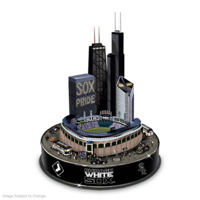 For Chicago White Sox fans, there's no day like game day at U.S. Cellular Field. Now, you can celebrate the pride and fun that surrounds your favorite baseball team with this festive Chicago White Sox collectible carousel, available from The Bradford Exchange.Officially licensed by Major League Baseball Properties, this Chicago White Sox  carousel is a memorabilia handcrafted in artist's resin and features an authentically detailed stadium sculpture with the city's towering skyline in the background. Around the park, die-hard fans on foot and in vehicles rally in a victory parade that really moves around the stadium. To add to the team spirit, this Chicago White Sox home decor lights up from within and plays the melody of "Let's Go, Go, Go, White Sox!"  Edition limited to 3,000, and strong demand is expected for this animated musical carousel, so order now!