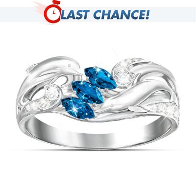 Dolphins are truly majestic in nature with a grace unsurpassed by any other creature in the sea.. As their sleek bodies swiftly cut through the water or leap in the air, they seem to reflect the sea's jewel-like colors from the deepest royal blue to tranquil teal. This stunning sterling silver dolphin ring captures the beauty of these magnificent animals in their element with three marquise-cut blue cubic zirconia stones at the center that change from a deep royal blue under incandescent light to a tranquil teal blue in bright light.  This original design is inspired by the art of celebrated marine artist Christian Riese Lassen and exclusively from The Bradford Exchange. Surrounding the center stones, and extending down the sides of the ring, are finely sculpted dolphins swimming in waves of crystal-clear cubic zirconia stones. The unique dolphin jewelry arrives in a custom presentation case that is perfect for safekeeping or for gift giving to someone who treasures the sea. Strong demand is expected, so order now!