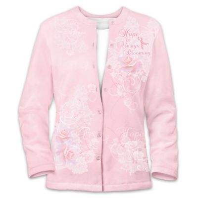 Now you can surround yourself with designer style and show your personal commitment to breast cancer awareness with this breast cancer support pink cardigan sweater, a design exclusive from The Bradford Exchange. This soft and warm layering essential sends a powerful message that we'll never stop searching for a cure. The delicate rose design of this fine apparel beautifully expresses the thought that breast cancer Hope is always blooming in the hearts of women everywhere, and a portion of the proceeds from your purchase will be donated to support breast cancer awareness and research.This classic cardigan design features custom rose artwork, elegantly integrated with the word "Hope" presented in delicate calligraphy. Accents of faux jewels and a pink "jeweled" breast cancer awareness ribbon add just the right touch of sparkle. Expertly crafted of fine imported cotton-blend knit chosen for its softness and wearability, this pink cardigan sweater artfully expresses your passion for this important cause while adding contemporary flair. You don't want to miss this elegant and meaningful work of apparel art, so order now!