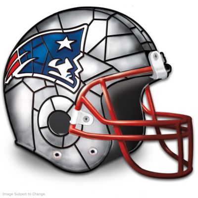 There's nothing prouder than a Patriots fan! Now, display an illuminated tribute to your favorite football team with this first-of-its-kind New England Patriots accent lamp, available exclusively from The Bradford Exchange. Inspired by the stained-glass artistry of Louis Comfort Tiffany and fashioned in the shape of a Patriots helmet, this exclusive New England Patriots decor serves as a unique way to showcase your team loyalty.This collectible football helmet lamp boasts a metal facemask for a sense of realism and is handcrafted of durable vinyl in New England Patriots team colors with a raised logo. Officially licensed by the NFL and brimming with realistic details, this limited-edition Patriots lamp really lets your Patriots pride shine and it makes a dazzling gift to any Patriots fan! High demand is expected, don't wait to secure yours. Order now!