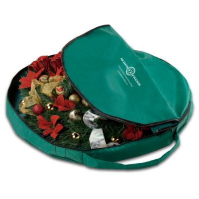 When it comes to putting away holiday decorations, it takes the right storage equipment to have a carefree Christmas. Make carrying and storage a snap with this clever pull-up 2-ft. Christmas tree storage bag, available only from The Bradford Exchange.Crafted of durable woven polyester in an attractive holiday green, this practical zippered artificial Christmas tree bag stores all the components of your 2-ft. pull-up tree, including the center pole, steel frame and support stand. Plus, it comes with an easy-carry handle, so you can transport your pre-lit Christmas tree up and down stairs. This handy Christmas tree bag makes it as simple to store your 2-ft. tree as it was to assemble it. Collapsing to only 4-1/2" high, for storage in extremely small spaces, this is an invaluable Christmas accessory you can't afford to miss. Order now!