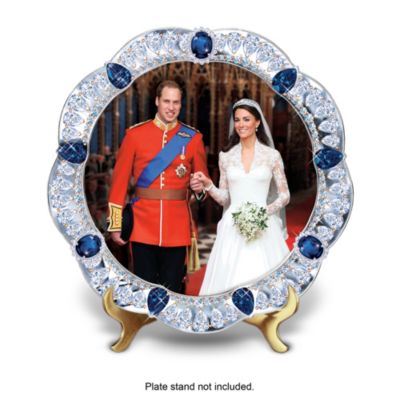 Uniting Prince William and Kate Middleton in marriage, the fairy-tale Wedding of the Century was everything the world had hoped for! Celebrate the Prince William and Kate Middleton wedding with the limited-edition It's Official! The Royal Wedding Jeweled Collector Plate, available exclusively from The Bradford Exchange.Handcrafted of lustrous Heirloom Porcelain&reg;, this dazzling collectible gloriously showcases the couple's joy on their wedding day at Westminster Abbey in a full-color image of Prince William in his Irish Guards Royal Army uniform and Princess Catherine radiant in her Alexander McQueen gown. Lavished with hundreds of shimmering simulated diamonds, simulated sapphires and settings that recall Princess Catherine's legacy engagement ring, the border of this Prince William and Catherine, Duchess of Cambridge collector plate is graced with a genuine platinum border and an elegant scalloped design. Strong demand is expected, so don't delay. Order now!