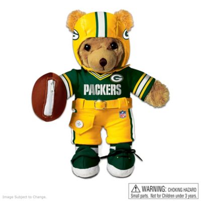 Coaching little kids is his game! This cuddly coach makes learning how to dress, count and say your ABCs easy and exciting with his adorably winning style. Introducing an interactive Green Bay Packers teddy bear ready to take your child on a fun-tastic educational journey. Sprint across countless "yards" of developmental learning with this Green Bay Packers dress up teddy bear, officially licensed by NFL Properties LLC and available from The Bradford Exchange Heirloom Toys.  Teaching 10 fundamental tips, just squeeze this Green Bay Packers football toy's soft paw to hear him recite the alphabet or his 1,2,3s, and when it's time to hit the field, a squeeze of his foot has him cheering "Go Packers." Your child will learn to snap, buckle, Velcro, button, zipper and tie with this Green Bay Packers teddy bear's interactive uniform, complete with a zippered football. For educational football fun every day, discover one totally huggable bear who is so touchdown true lovable. Not available in stores. Order now!