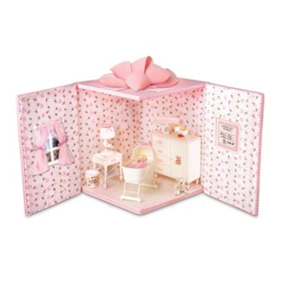 Good things come in very tiny - and pretty packages! A unique miniature baby doll proves the old saying. Just unfold the sides of the "Special Delivery" box and you'll reveal an entire nursery room in perfect miniature. Have a peek into the bassinet in the center of the room and see a tiny realistic baby doll, just 1-1/2 inches long!Available exclusively from The Ashton-Drake Galleries, this miniature baby doll harkens back to a simpler time. The furniture and accessories in this tiny nursery are in 1950s style, and every piece is separate and movable so you can arrange the room any way you like. Plus, the baby doll is handcrafted in realistic resin, and has her own miniature birth certificate on the wall that you can personalize. Intense demand is expected for this miniature miracle, so don't wait. Order now!