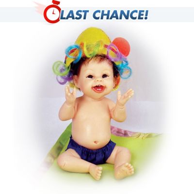 She loves to laugh and play - and she's sure to make you smile! This circus baby is a 5-1/2"-long miniature baby doll by acclaimed Master Doll Artist Sherry Rawn. This happy little one has expressive features including big eyes, rosy cheeks and a beautiful, laughing smile. Baby sits with arms raised in celebration, wearing a big hat with multi-colored attached "hair" over her own pretty hair.An Ashton-Drake Galleries exclusive, this good-natured girl is expertly recreated in resin, then hand-painted for attention to realistic detail. She comes with a FREE blanket featuring the phrase "Does Something Smell Funny," along with a colorful trim. Join her in all the fun. Strong demand is expected for this resin baby doll, so order now!