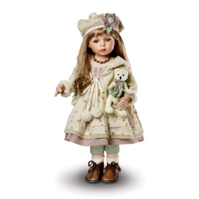 The great outdoors is meant for exploring, and that's exactly how this sweet collectible porcelain doll and her "beary" special friend will while away the day. Lovely Shirlee is beautifully dressed and she comes with a FREE plush bear in a matching outfit. With her hand-painted fine porcelain face, hand-set eyes and long lashes, this cutie pie and her companion are ready for hours of playtime.Join in on the fun of an out-of-doors adventure with this vintage style doll, an exclusive from The Ashton-Drake Galleries. Shirlee's ensemble includes a floral-patterned dress with coordinating pantaloons, a jacket with ribbon and simulated fur accents, and a cap with floral-trimmed band. Exceptional demand is expected for this heirloom porcelain doll, and you don't want to miss out. Order now!