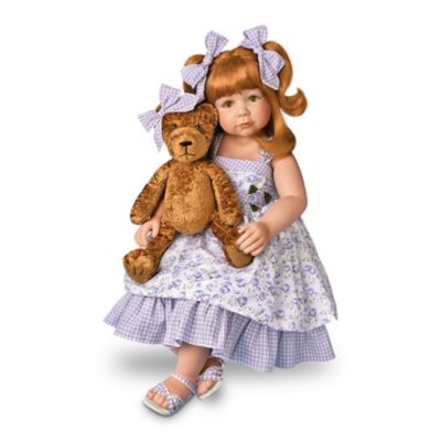 You're going to love meeting Hannah, a lifelike child doll dressed so prettily for summer in her purple floral dress. She shares the sunny weather with her favorite plush teddy bear named Harper, cuddled in her lap. Only an artist as talented as Diane Bucki could bring you this impressively sized, 32-inch doll with her lovable teddy companion. This masterpiece of the dollmaker's art comes to you as an Ashton-Drake Galleries exclusive that will become an important part of your collection.Hannah is expertly handcrafted in collector-quality vinyl with an exquisite hand-painted complexion, silky red hair and luminous green eyes. She's dressed in a layered, floral-print and gingham cotton sundress with matching gingham bows in her hair. Her beloved plush teddy bear, generously sized at 15 inches, wears a gingham bow that matches hers. Demand for this truly memorable lifelike child doll and plush teddy bear from Diane Bucki is likely to be high. So be sure to order now!