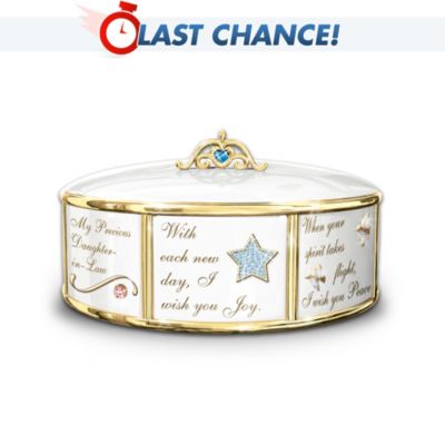 Celebrate the daughter-in-law who has blessed your life with this limited-edition Italian charm bracelet-inspired music box, an Ardleigh Elliott exclusive. Designed to look like an Italian charm bracelet, this collectible music box gift for your daughter-in-law sparkles with elegant, jeweled beauty to remind her of your love every day. Each "charm" has its own blessing and is adorned with 22K-gold script and sparkling accents, including a hand-set Swarovski&reg; crystal or glittering simulated jewels. Accompanied by the melody of "You Are So Beautiful," it's the perfect message of love to give your daughter-in-law. Strong demand is expected for this porcelain music box - order now!California Residents click here for Proposition 65 notice.