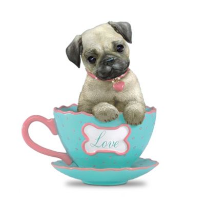 Get ready for a spot of tea and a cup of cuteness! One look in her adorable big eyes and you'll fall in love with this irresistible pampered pooch. This collectible pug teacup figurine sits inside a teacup, with her head tilted and paws hanging over the side. She has floppy ears and a collar sparkling with simulated gems. Her delicate teacup features a polka dot design, scalloped edge, and a bone-shaped sign inscribed with the word, "Love." This charming and loveable pooch is exclusively from The Hamilton Collection. She's handcrafted in artist's resin for lifelike detail, then hand-painted and finished with a porcelain-like glaze on the teacup for a rich luster and lasting beauty. She makes a treasured gift for a pug lover. High demand is expected for this limited-edition figurine, so order now!