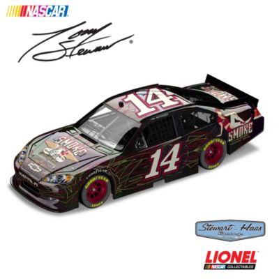 He competed in the Indianapolis 500 and the Coca-Cola 600 on the same day, won championships in stock cars, Indy cars, open-wheel Midget, Sprint and Silver Crown cars, and has scored multiple Sprint Cup Championships - there's definitely only one Tony Stewart! Now a collectible Smoke diecast car celebrates Tony's one-of-a-kind personality and style, clearly on display during the 2011 NASCAR Sprint Cup Series. This 1:24 scale Tony Stewart diecast car captures all the excitement of one of NASCAR&reg;'s most dynamic drivers and his No. 14 Chevy Impala, and it's available from Motorsport Editions.Fully licensed by Stewart-Haas Racing, this precision-engineered Tony Stewart collectible is the fourth in the Lionel&reg; NASCAR&reg; Collectable's series of fantasy diecast cars custom designed for and authorized by Tony Stewart, and it features a diecast body and chassis, opening hood, trunk and roof flaps, manufacturer-specific engine detail with valve covers, accurate header contour, simulated exhaust openings and more. Sporting a smokin' red and black paint scheme, with throwback pinup artwork, your Tony Stewart diecast car is crafted with over 100 individual parts and imprinted with a special DIN for registration, and to maintain authenticity. Don't miss this bold Smoke diecast; makes a great NASCAR gift too. Strong demand is expected. Order now!
