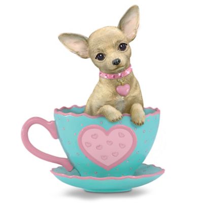 She's all dressed up and ready to join you for a spot of tea. One look into her adorable eyes and you'll always be ready for teatime with this limited-edition Chihuahua teacup figurine from The Hamilton Collection. This chic Chihuahua has big, beautiful eyes, pointy ears, an adorable head tilt you won't be able to resist. Her collar is adorned with sparkling, simulated gems and a heart charm, and she sits inside a teacup with her paws hanging over the side of the cup. You'll fall in love with this charming pooch and her dainty teacup that features scalloped edges, a big pink heart and a polka dot design. She's handcrafted, then hand-painted and finished with a porcelain-like glaze for a rich luster and lasting beauty you'll enjoy for years to come. Strong demand is expected, so order now!