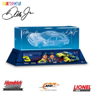 On July 2, 2010 Dale Earnhardt Jr. got behind the wheel of his father's famous #3 Wrangler paint scheme for the NASCAR Nationwide Series Subway Jalapeno 250 and took the win for an all around perfect tribute to his legendary father. Celebrate the Dale Earnhardt legacy and his induction into the NASCAR Hall of Fame&reg; with the "Salute to Dale #3" laser-etched crystal block, exclusively from Motorsport Editions.Dale's classic #3 Wrangler paint scheme emblazoned on Dale Jr.'s winning Chevrolet Impala and both drivers' replica signatures are handsomely laser-etched inside a crystal-clear block of optically pure glass. With the flip of a switch, LED technology illuminates the block to showcase every remarkable detail. The custom-designed base features a classic Earnhardt family montage of father and son along with Dale's classic Chevy and Dale Jr.'s special #3 Wrangler ride! Due to the historic nature of this event, high demand is expected for this limited edition of only 3,333. Don't delay - order now!