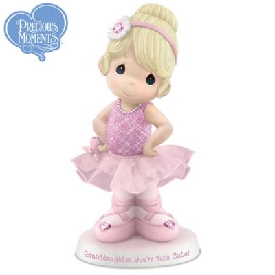 Your granddaughter brightens up your world like no one else can, especially when she dances to express all her joy and energy! Now this adorable Precious Moments&reg; ballerina figurine captures the spirit of your granddaughter as a ballerina, with all of the innocence and expressiveness inspired by artist Sam Butcher's beloved Precious Moments art. This fine porcelain limited-edition figurine even bears a loving inscription, making it the perfect granddaughter gift!Available exclusively from The Hamilton Collection, this collectible Precious Moments ballerina figurine is handcrafted in fine bisque porcelain with hand-painted details, and dressed in a ballet costume with a skirt of pink tulle. Her ballet slippers and headband are accented with sparkling "jewels," and her costume is covered with exceptionally fine, hand-applied glitter, with a pearlescent glaze on her necklace. With her hands on her hips, she looks to you for applause - and how can you resist? The base of this ballerina figurine bears the message "Granddaughter, You're Tutu Cute!" and is inscribed with Sam Butcher's replica signature. Strong demand is expected for this memorable Precious Moments granddaughter gift so don't delay; order now!