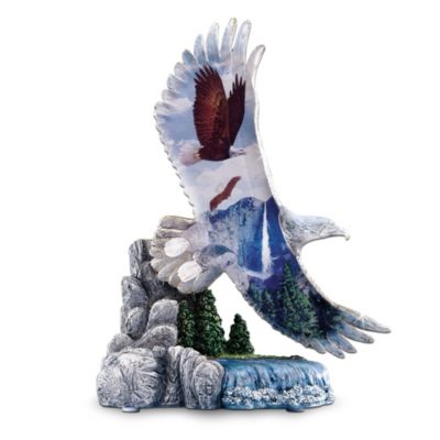 Full of boundless spirit, the American bald eagle represents strength, courage and, above all, freedom. Now, the bald eagle's noble spirit is captured in a striking tribute as enduring as our country's proudest symbol of freedom. The Hamilton Collection is thrilled to introduce Guardians On High - a limited-edition bald eagle figurine that soars with dramatic beauty and meaning.Handcrafted of shimmering crystalline, the sculpted eagle's outstretched wings boast a full-color panorama of glorious bald eagle artwork. Perched atop a hand-painted landscape base with a stone look, reminiscent of the eagle's natural habitat, this collectible bald eagle figurine is a thrilling way to honor our nations noble guardian of liberty. Edition is limited to only 95 castings days - order now!