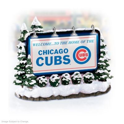 Now, here's a really imaginative Chicago Cubs&reg; village accessory - an illuminated Chicago Cubs billboard! Officially licensed by Major League Baseball Properties and available from Hawthorne Village, this handcrafted Chicago Cubs billboard accessory is the perfect way to add game day excitement to your beloved Chicago Cubs village display!You'll love the way the four working billboard lights at the top illuminate the Chicago Cubs logo and bold club colors. And take a close look at all the detail in the surrounding snow-covered shrubs and trees - it's so realistic! Don't miss this must-have Chicago Cubs village collectible - order now!