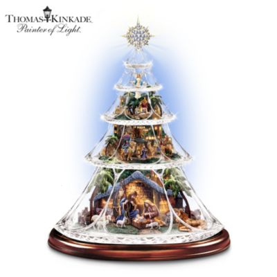 The story has inspired people for 2,000 years! Let it inspire you all over again with this first-of-a-kind Thomas Kinkade genuine crystal tabletop nativity tree. Handcrafted sculptures grace each of the tiers to share the meaning of Christmas, with an angel, shepherds, Three Wise Man and the Holy Family. An intricate diamond-pattern complements the snowflake pattern on each shimmering tier.This Hawthorne Village limited-edition exclusive lights up and plays the beloved Christmas melody, "Silent Night." A gold-tone star, with nearly 60 sparking simulated crystals, tops this magnificent Christmas nativity decoration. And a name-inscribed wooded base adds the perfect finishing touch. Strong demand is expected for this musical Christmas decor inspired by the artistry of Thomas Kinkade, so order now! California Residents click here for Proposition 65 notice.