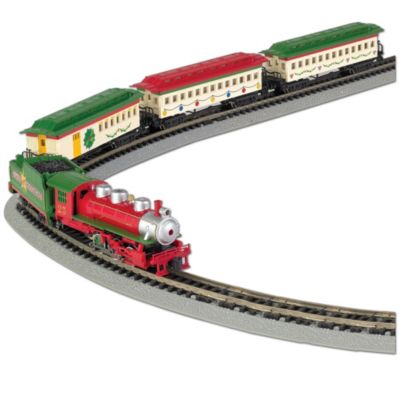 All aboard for a very merry holiday! It's easy to see that good things come in small packages when you catch a ride on The Spirit of Christmas - a real working N scale train set including everything you need to get started. This festive Christmas train set is sure to add a touch of holiday spirit to your home and is perfect for an under-the-tree presentation, or to showcase in small spaces. An official Bachmann train set, it is available from The Bradford Exchange, Hawthorne Village Division.  Meticulously crafted by master artisans with precision detailing, this collectible Christmas train set includes an 0-6-0 N scale steam locomotive and tender, vintage combine, and two vintage coaches - all decked out in the colors of the season, along with 16 sections of E-Z Track&reg;, power pack and speed controller. Plus, your N scale train set includes an illustrated instruction manual to get things rolling. Strong demand is expected for all of our N scale trains and accessories, so don't wait. Order now!