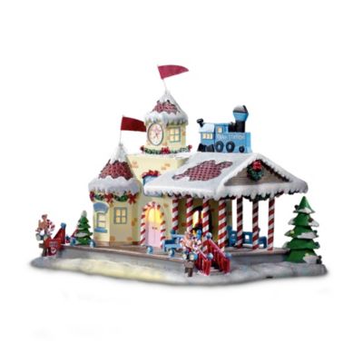 The heartwarming story of Rudolph the Red-Nosed Reindeer&reg; has captured our hearts and imaginations for decades. Now the spirit of that reindeer with the bright-and-shiny nose is celebrated with an heirloom-quality Rudolph&reg; train accessory. Inspired by the classic television special, this illuminated Christmas Town train station glows with the warm invitation of the holidays, and best of all, it plays the beloved melody of Rudolph the Red-Nosed Reindeer.  This festive Rudolph train accessory makes a perfect addition to an On30-scale train set or collectible village, and is available only from The Bradford Exchange, Hawthorne Village Division. The Christmas train station is meticulously handcrafted with intricate detailing like candy-cane posts, decorated holiday trees and a tower clock, it's the perfect welcome to Rudolph's Christmas Town. Strong demand is expected for this Christmas train station and you won't find a finer value anywhere, so order now!