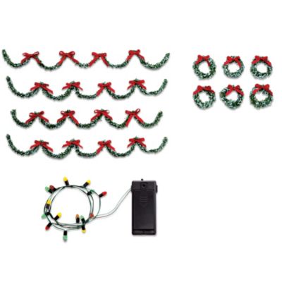 Nothing makes the holidays more beautiful than snow on the rooftops, wreaths on the windows and lighted garlands of greenery. Now, you can turn your village into a Christmas showplace with a "Holiday Trimmings" accessory set from Hawthorne Village. And it's fast and easy to arrange and remove wreathing and lights because the holiday accessory kit comes with removable accessory adhesive that won't damage your favorite village buildings. These realistic accents are sure to enhance many Christmas displays, so order enough to decorate them all. Shop Now.