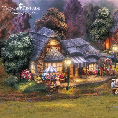 The romantic vision of Thomas Kinkade transports you to a radiant place where enchanting lamplights glow like luminous pearls on flower-lined paths. Warm lights stream from every cozy cottage, church and shop in the Thomas Kinkade Lamplight Village collection, starting with Issue One featuring Falbrooke Florist and FREE florist and her flower cart figurine. Soon, you'll enjoy a stroll across Issue Two, Lamplight Bridge, which includes a FREE set of six lamplights and artist figurine. Additional village buildings, each a separate issue and some with select free figurines and accessories, will follow.This landmark village collection is a Hawthorne Village exclusive, inspired by the original works of acclaimed artist Thomas Kinkade and approved by the Painter of Light himself. You'll be amazed by the extraordinary handcrafted details - each tiny flower, each individual leaf is meticulously painted by hand. Don't wait! Strong demand is anticipated and you don't want to miss the radiant experience of owning the Thomas Kinkade Lamplight Village collection! Order now!