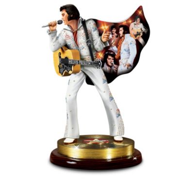 Celebrate how a legend dressed for rock-and-roll success with this show-stopping musical Elvis&reg; tribute figurine collection. Each Elvis Presley&reg; figurine in this collection boasts a "canvas" superhero-style cape showcasing a vivid montage of Elvis portraits by renowned artist Bruce Emmett. Starting with Issue One, The Sensation, this sizzling singer will soon be joined by Issue Two, The King of Rock 'n' Roll&reg;. Later, your collection will be enhanced by additional collectible Elvis tribute figurines, each a separate issue to follow.The collectible musical Elvis tribute figurines in this collection are available only from The Bradford Exchange, and each plays a memorable Elvis melody, including "Hound Dog." The eye-catching figurines in this collection are entirely hand-cast and hand-painted to highlight every fantastic detail. The "gold record" bases on these collectible Elvis figurines showcase Elvis' distinctive replica signature. What a must for an Elvis collection or an ideal collectible Elvis Presley gift. Intense demand is expected for these amazing limited editions, so order now!