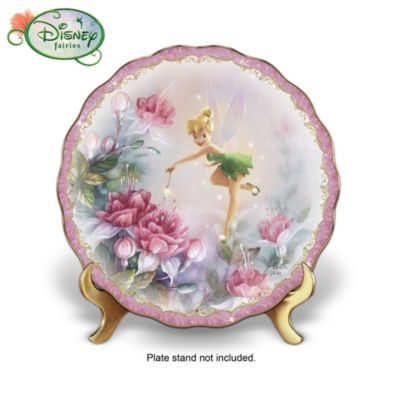 Never before has there been a combination so enchanting! Introducing Bradford Exchange's first-ever collection of Disney Tinker Bell collector plates filled with splendid Lena Liu floral artistry. Fill your home with a floral bouquet and a touch of Tink every day, starting with Issue One, The Finishing Touch. Soon, you can look forward to the magic of Issue Two, Sitting Pretty. Your collection will continue with even more Tinker Bell and Lena Liu collector plates, each a separate issue, to follow.Transform any room into a beautiful and magical garden with these special Disney Tinker Bell collector plates! Rimmed in rich 22K gold, each gently scalloped porcelain collector plate shimmers with the look of pixie dust for unique home decor that will make you a believer! Hurry to bring home this special limited-edition collection or give as collectible Tinker Bell gifts that won't soon be forgotten. Strong demand is expected and you won't want to miss out. Order now!Fine collectibles, not intended for children.