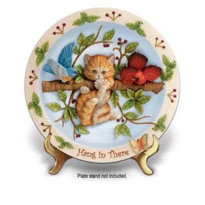 When times are tough, there's nothing like laughter to help see the brighter side of life. Now, you can celebrate cheerful thoughts with this humorous kitten-themed collector plate collection, beginning with Issue One, Hang in There. Soon your collection will continue with Issue Two, Don't Worry be Happy and additional collector plates, each a separate issue to follow.Exclusively from The Bradford Exchange, each darling collector plate in this collection is handcrafted in artist's resin and showcases an adorable hand-sculpted kitty surrounded by more richly-dimensional, endearing sculptures. Each limited-edition issue includes a decorative rim lavished with delightfully hand-painted details united with an uplifting sentiment. Heavy demand is expected for this inspiring cat lover's gift and you won't want to miss out. Order now!