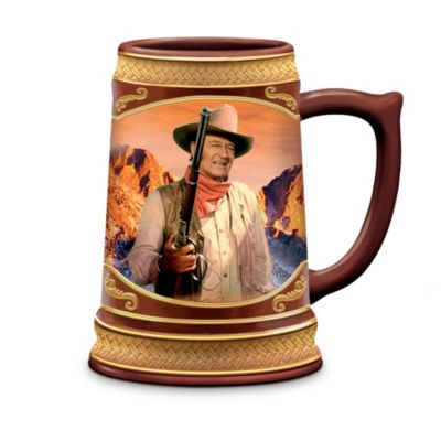 He captured the American spirit on the silver screen for five decades. Now you can raise a glass in honor of a true legend with these John Wayne porcelain steins! Each stein in this collection features a unique full-color portrait of John Wayne in one of his memorable Western movies on the front, and biographical John Wayne facts on the back. Your collection begins with Issue One, The Duke. soon, your collection continues with Issue Two, Western Legend, and additional Cheers to a Legend steins, each a separate issue to follow.‡These handcrafted, hand-fired steins are a limited-edition, officially authorized by John Wayne Enterprises and exclusively from The Bradford Exchange. They feature a Western theme and a textured design, including a low-relief rope border around the base and rim. They also feature raised-edge detailing finished in 22K gold that frames the image and rope borders. Don't miss your chance to raise a glass to Duke with these collectible steins. Strong demand is expected, so order now!