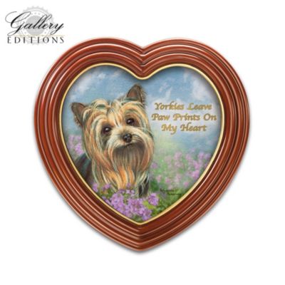No one captures your heart quite like a sweet Yorkie, and nobody captures the spirit of the Yorkie quite like the acclaimed artist Pollyanna Pickering! Celebrate your love for your furry friend with this Gallery Editions limited-edition Yorkie wall decor art collection, available exclusively from The Bradford Exchange. Featuring adorable Yorkie portraits by Pollyanna Pickering paired with heartfelt sentiments, your collection begins with Issue One, Yorkies Leave Paw Prints on My Heart. Soon, you will receive Issue Two, Everything is Better with a Yorkie Beside You and additional Yorkie canvas prints, each a separate issue to follow.Elegantly displayed in a mahogany-finished heart-shaped frame with golden trim, each Yorkie portrait in this collection is printed on gallery-quality canvas with an endearing sentiment about your furry friend in golden script. Display your love for Yorkies in your own home, or give as perfect Yorkie lover gifts. Strong demand is anticipated, so don't delay. Order now!